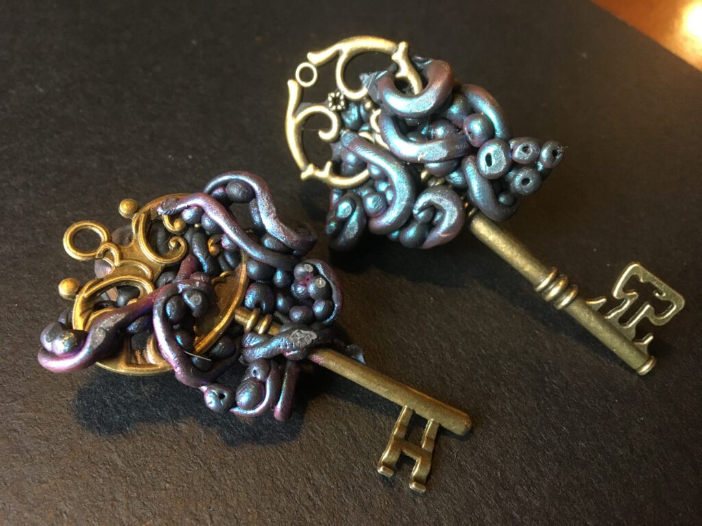 Octopus wrapped around an antique key - done in polymer clay