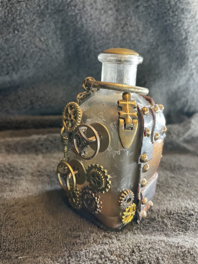 A bottle with gears and metal plates, steampunk style. A small key hangs from a chain