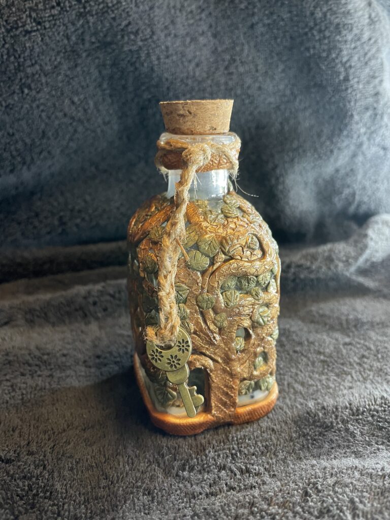 tree done in polymer clay on a bottle